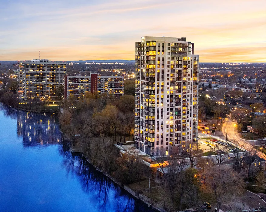 Jadco building by the river with the sunset
