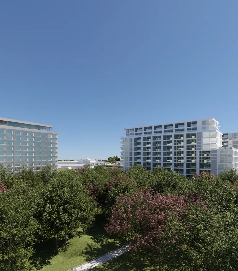 Vue de haut de deux immeubles modernes avec des arbres et un parc à l'avant-plan.